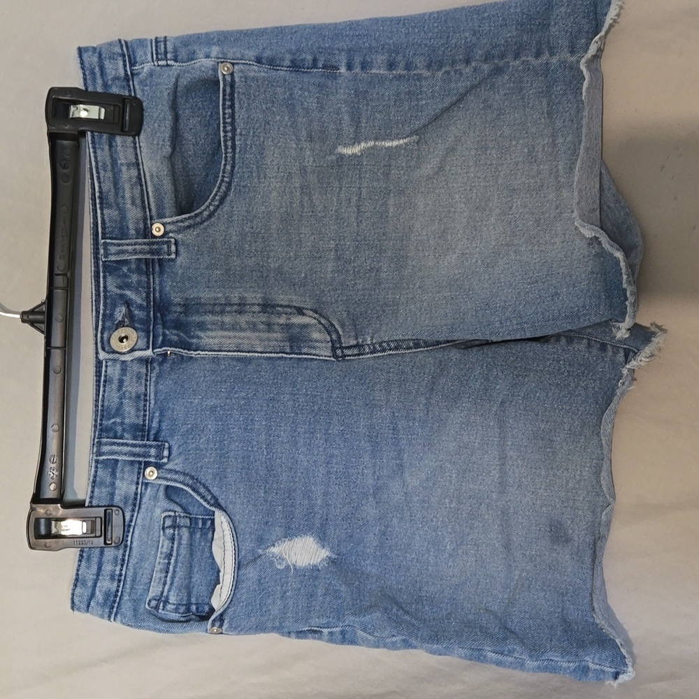 Distressed raw denim shorts